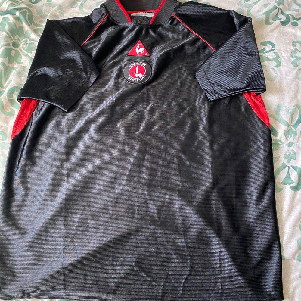 Le Coq Sportif Black and Red Jersey Sleek Design